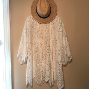 Love, Fire's scalloped white lace kimono